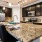 a kitchen with a marble island