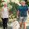 a man and a woman walking a dog on a leash