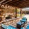 a patio with a pool and chairs