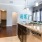 a kitchen with a marble counter top