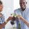 a few people toasting wine glasses