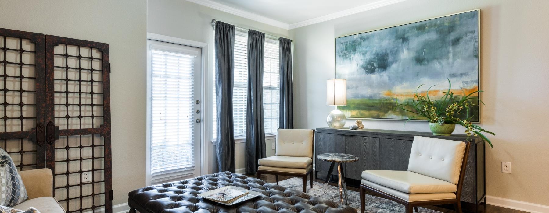 a living room with a large painting