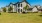 a large house with a lawn in front of it