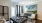 a living room with a large painting