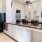 a kitchen with a marble counter