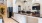 a kitchen with a marble counter